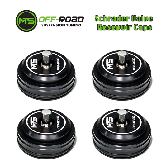 Four black Schrader valve reservoir caps with the MTS Off-Road Suspension Tuning logo on them.