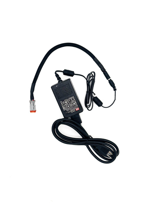 Black power adapter with cable on a white background