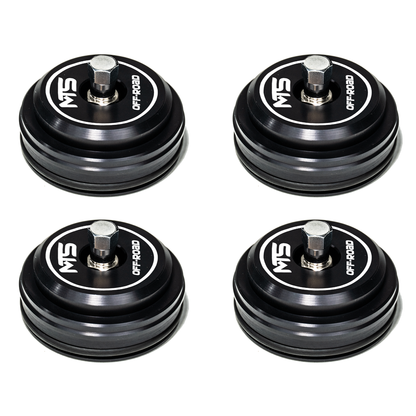 Four black MTS off-road components on a white background