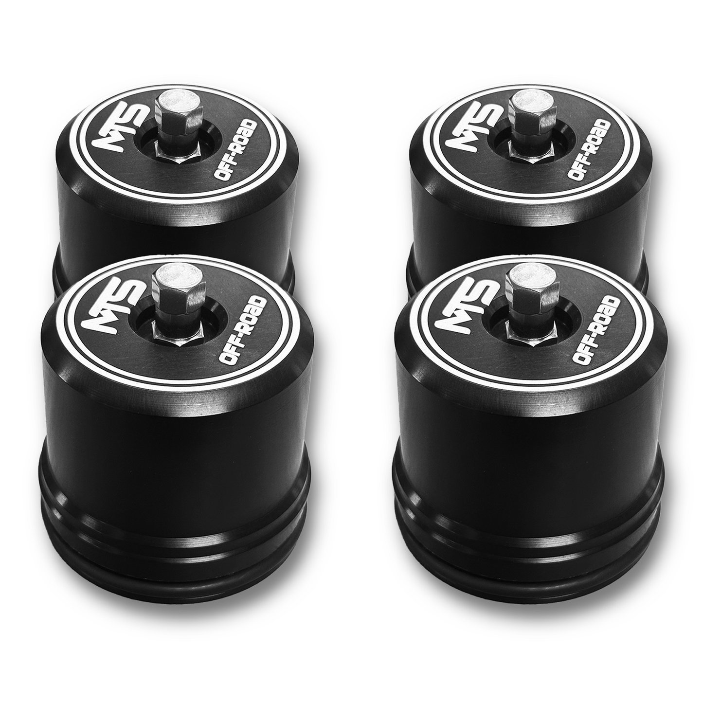 Four black wheel spacers with 'MST' branding on a white background