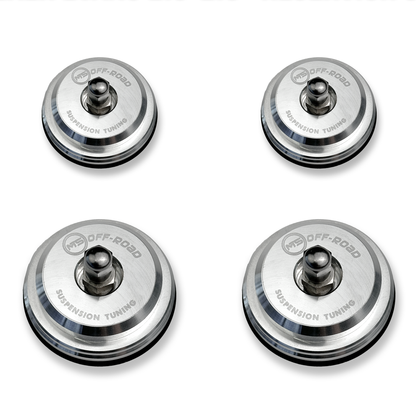 Four metallic suspension tuning components on a white background