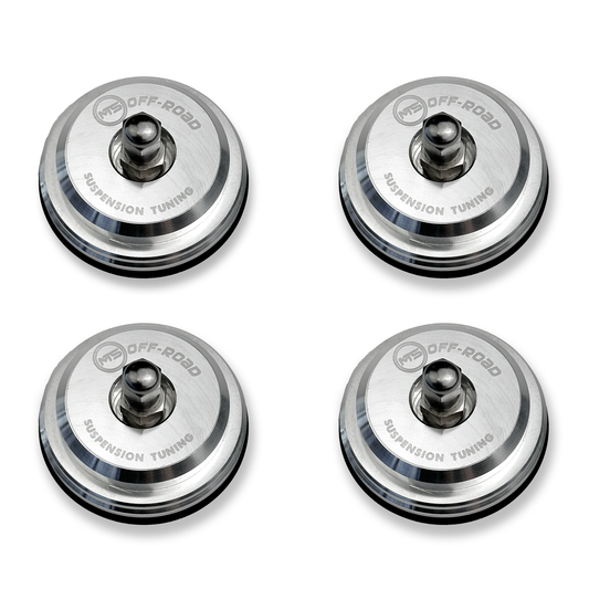 MTS Offroad Four metallic suspension tuning components on a white background