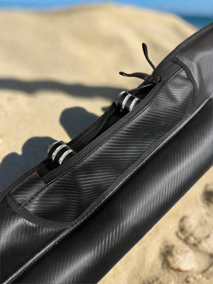 Black carbon fiber rod case on a textured surface