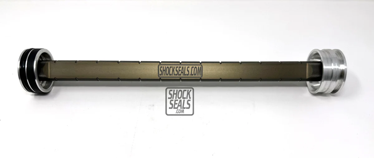 black and silver 3 in 1 IFP (Internal Floating Piston) Depth Setter / Puller tool with branding visible on it.