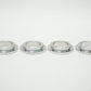 Coil spring adapters and ride height adjusters