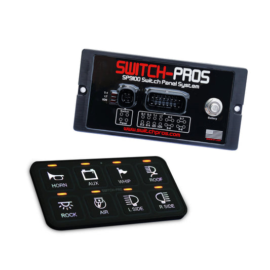 The image shows a black Switch-Pro SP9100 switch panel system, including the main switch panel with various switch labels such as 'HORN,' 'BLU,' 'WIP,' and others, along with a power module and connecting cables.